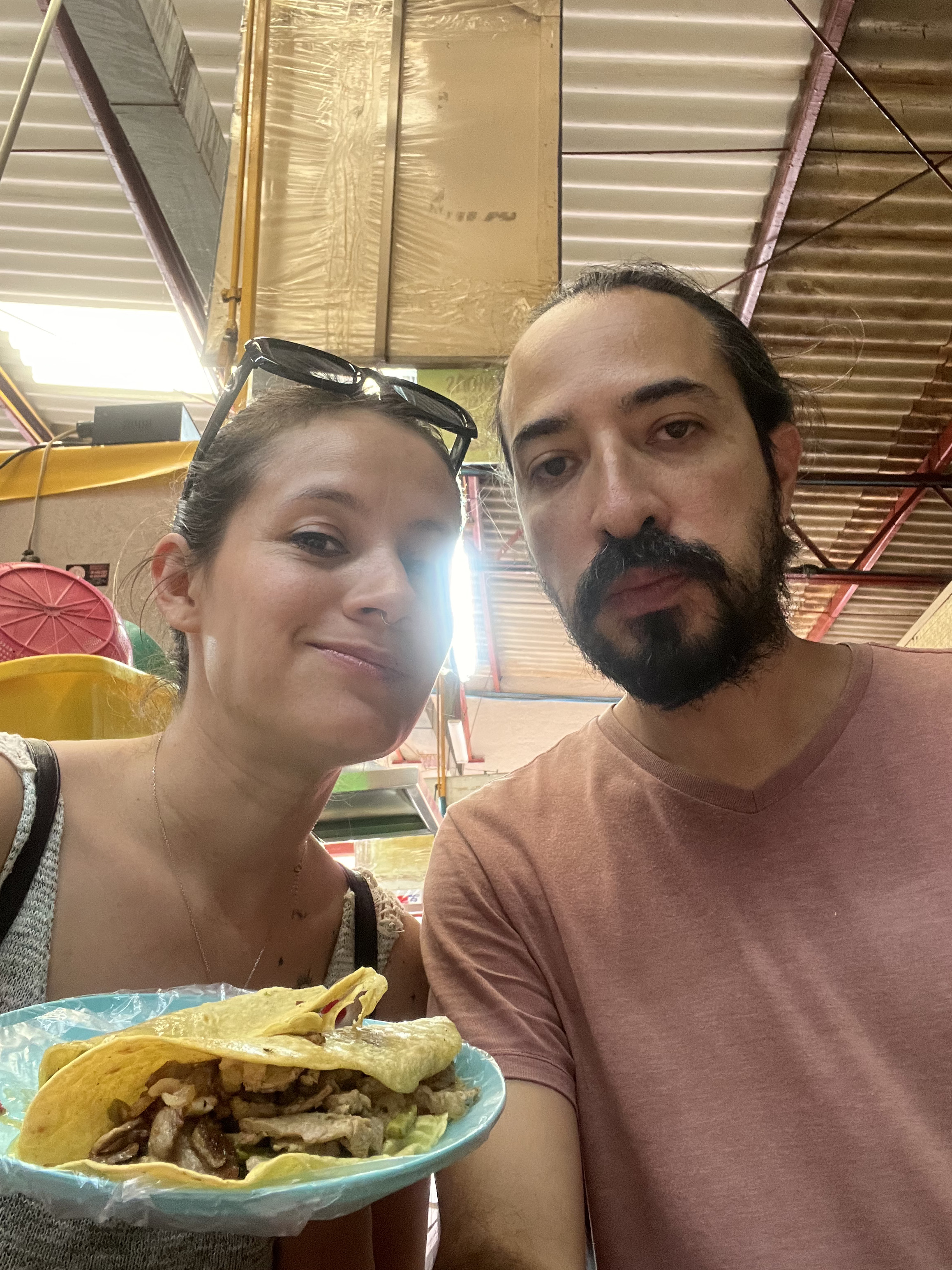 Carlos and María enjoying local food at a Mexico City market